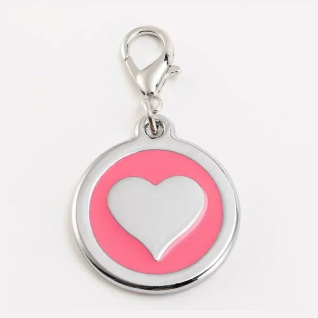 Pink heart-shaped keychain tag with a silver clasp on a white background