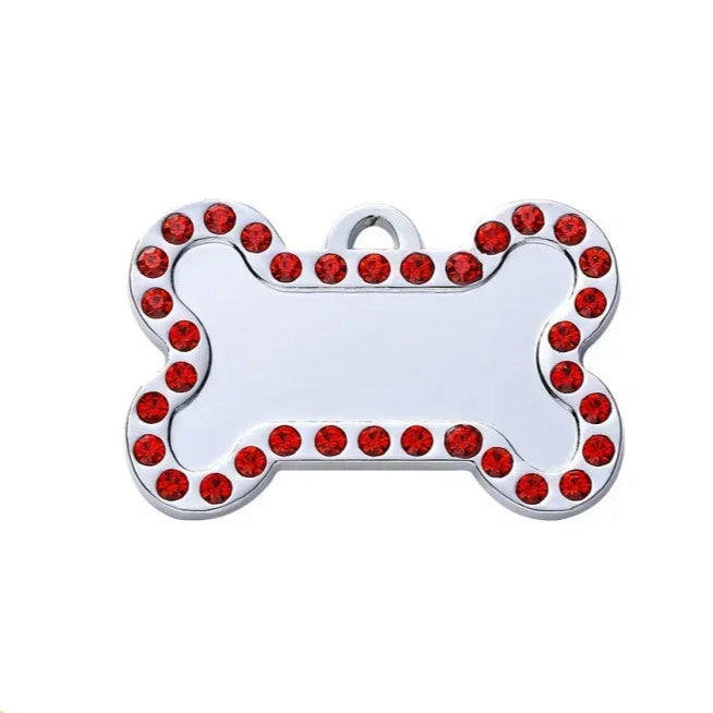 Dog tag with red gemstones on a white background
