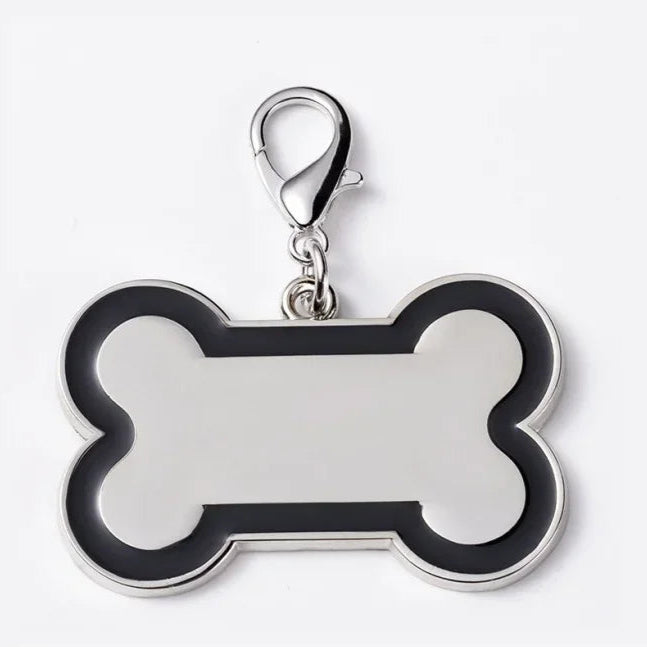 Bone-shaped pet tag with a silver ring on a white background
