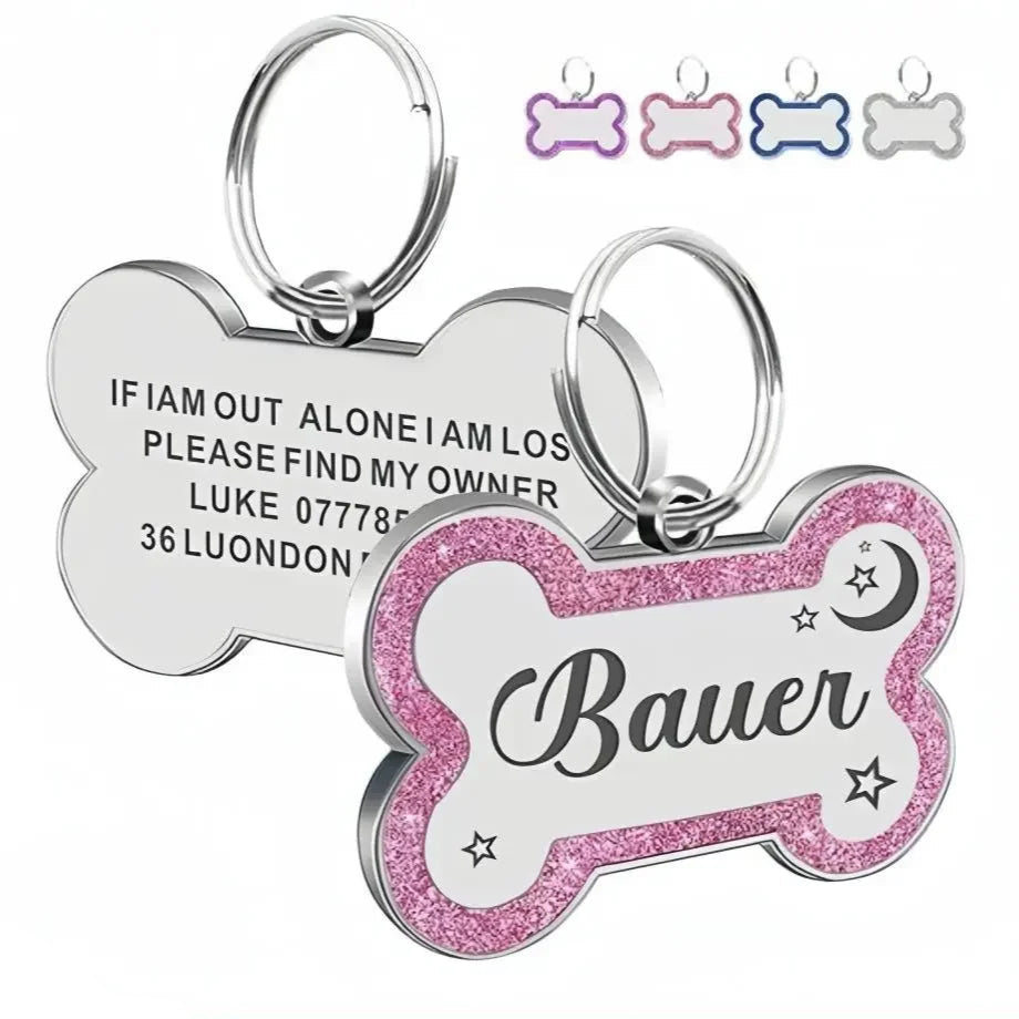 Two dog tags, one silver and one pink with glitter, on a white background.